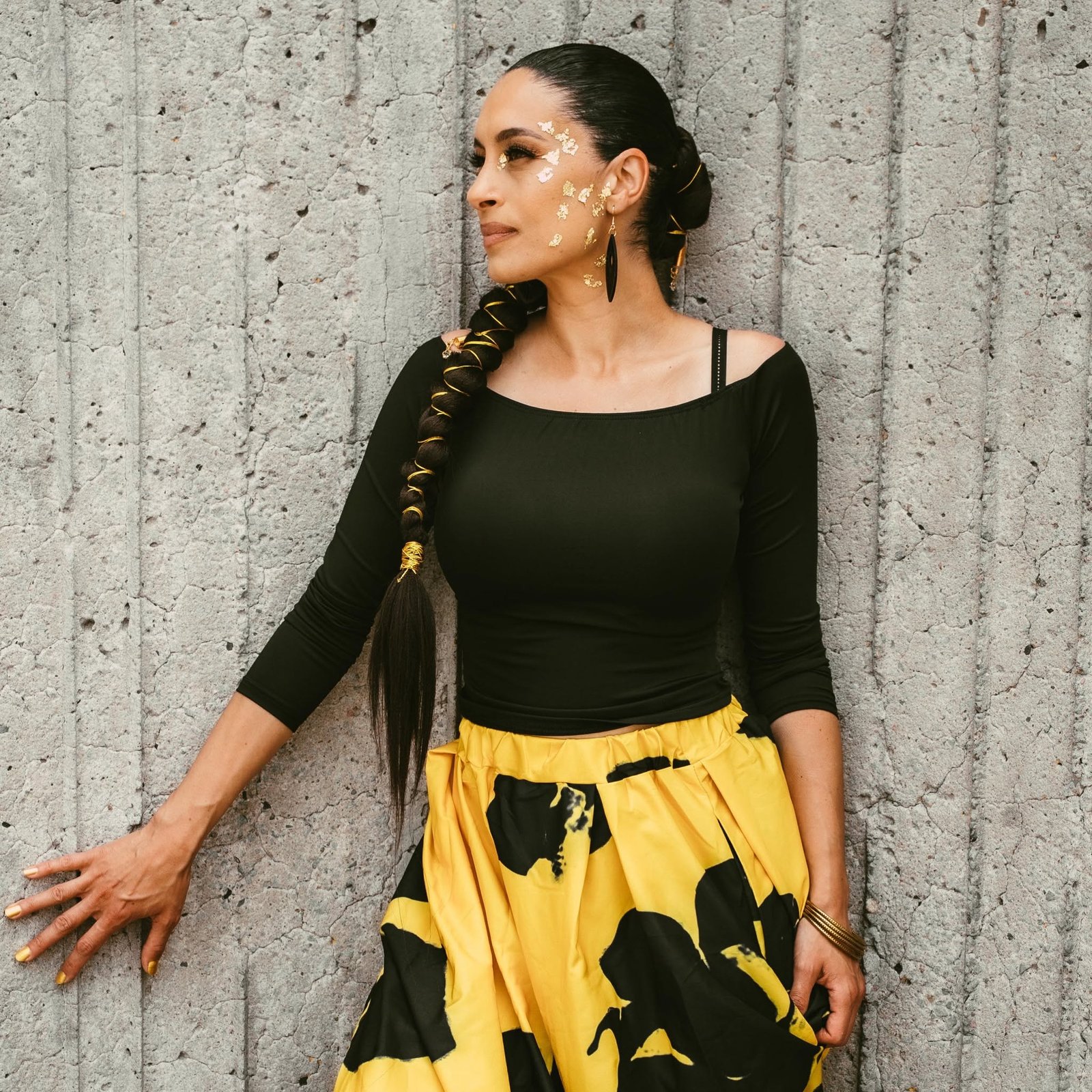 Portrait of Tiffany P. against textured concrete
